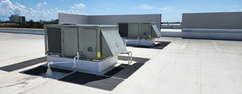 Professional HVAC technician servicing commercial units - Slide 2
