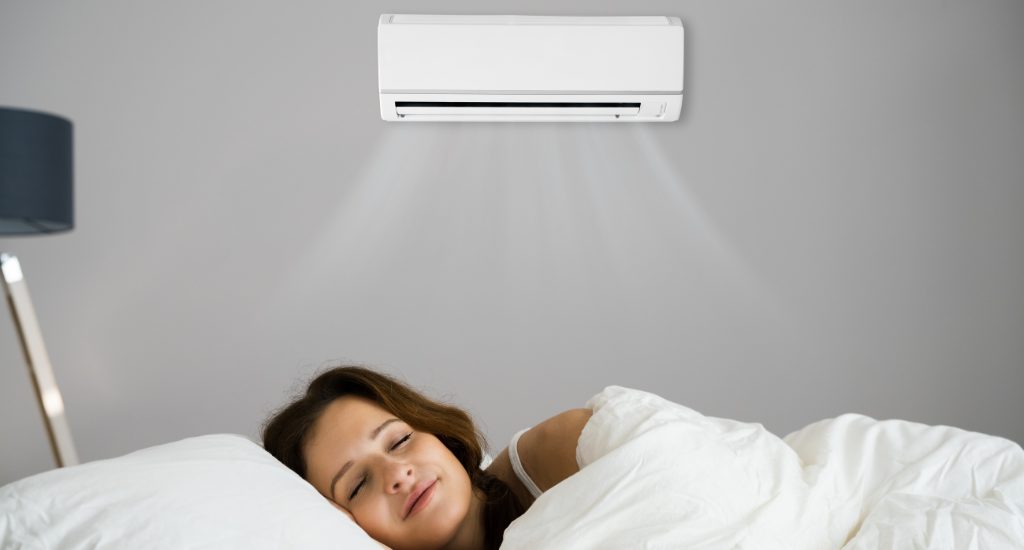 Women comfortably sleeping under AC